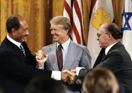 U.S. President Jimmy Carter facilitating the historic Camp David Accords between Egypt and Israel in 1978.